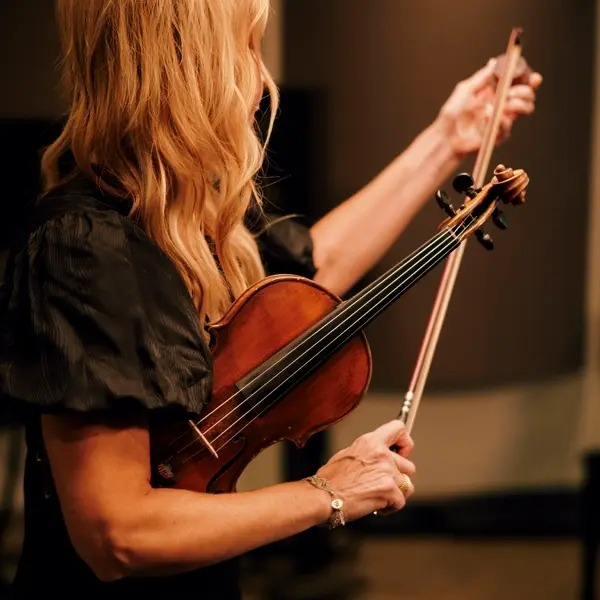 lady holding a violin