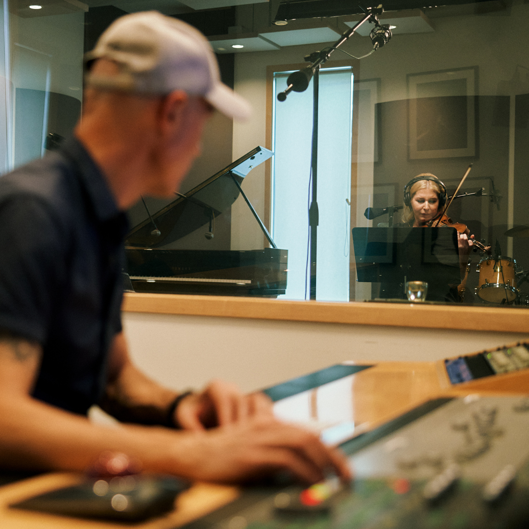 two musicians in recording studio