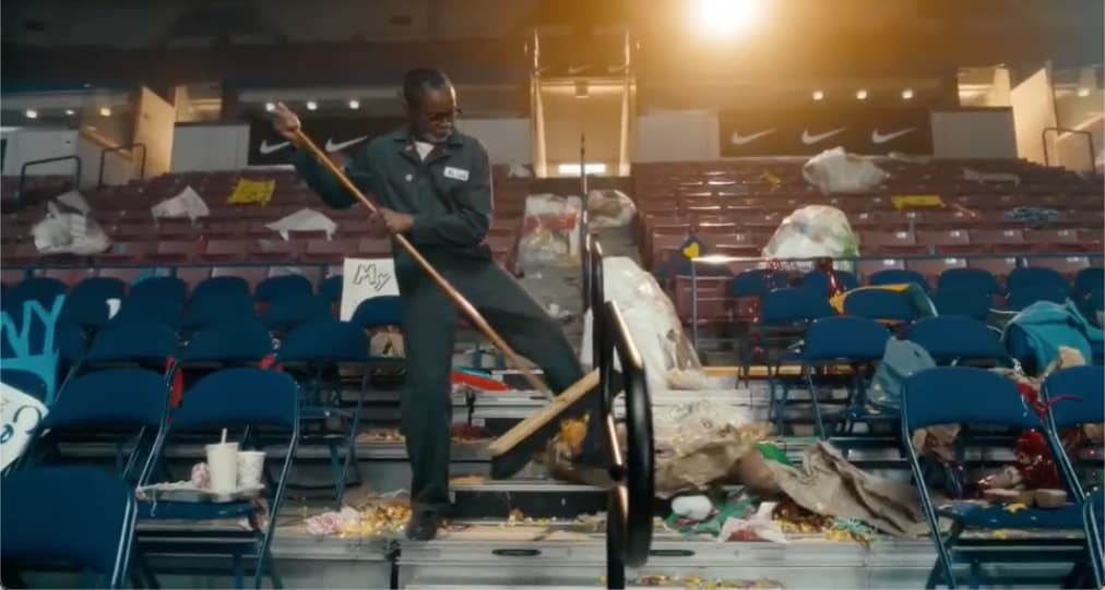 Janitor Cleaning Up Basketball Arena
